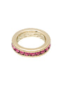 Gold ring with pink gemstones on a white background