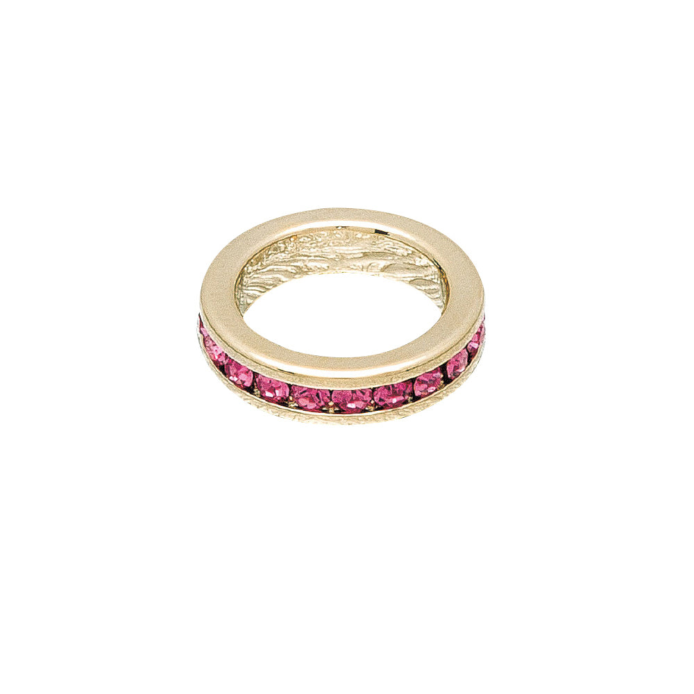 Gold ring with pink gemstones on a white background