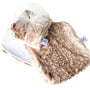 Beige sherpa blanket with a white shoe on a white background