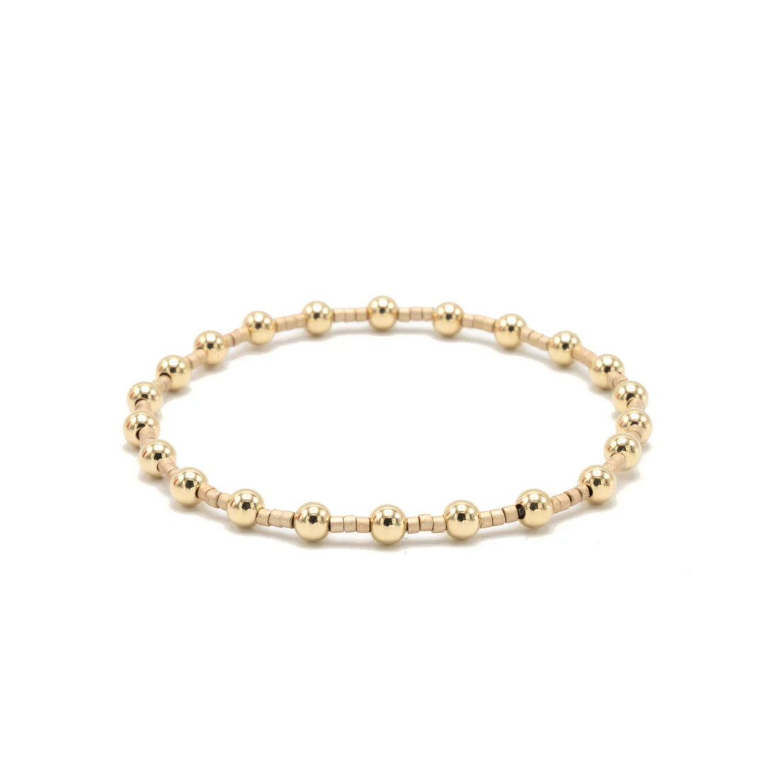 Gold beaded bracelet on a white background