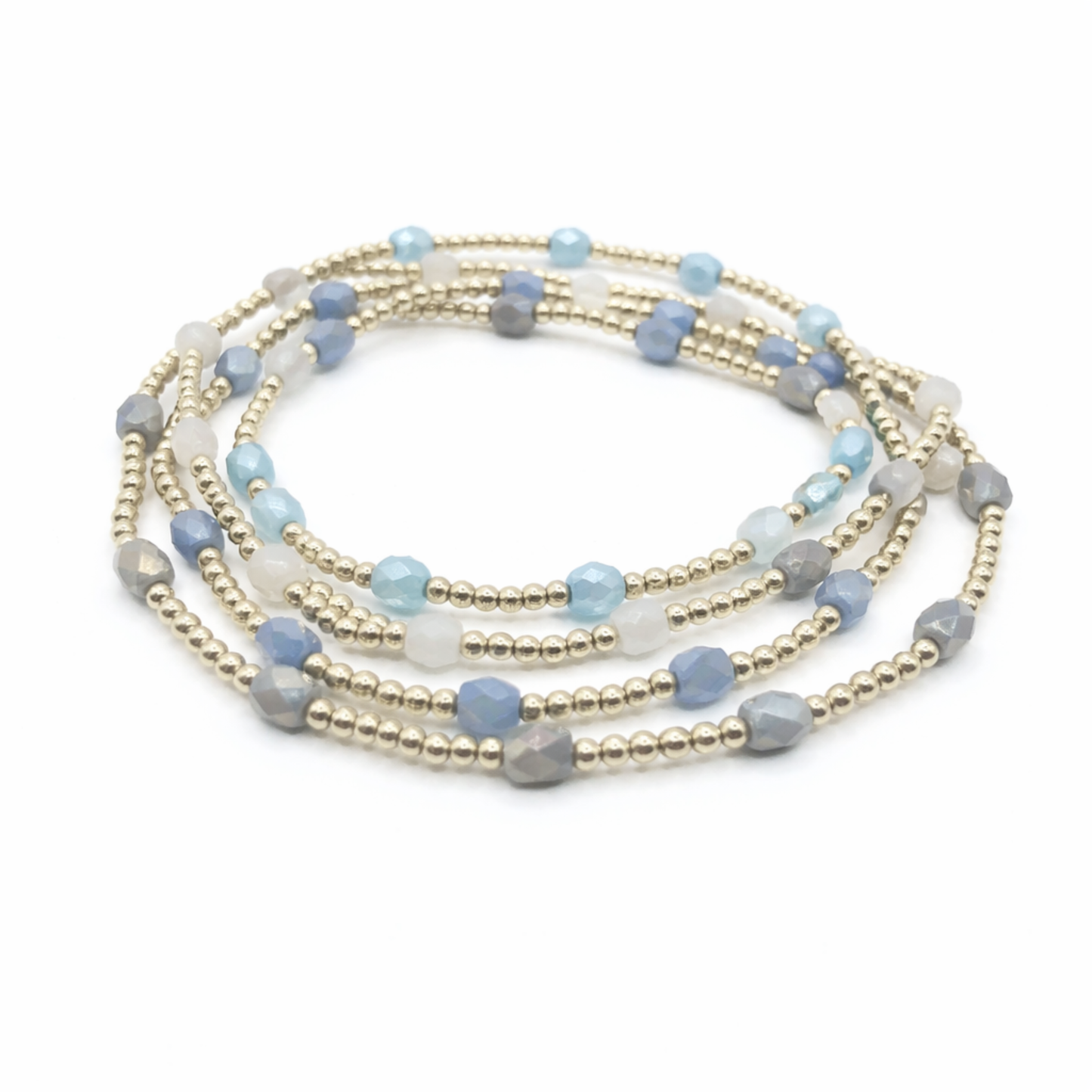 Set of beaded bracelets with blue, gray, and gold beads on a white background