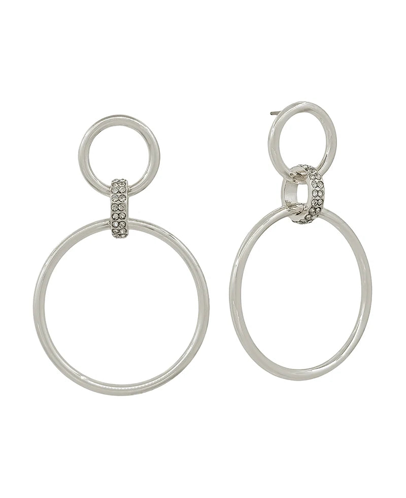 A pair of silver-tone drop earrings featuring a small circular hoop connected to a larger oval drop, with a small pavé-set accent between the hoops, shown on a plain white background.