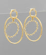 A pair of gold-toned drop earrings with large oval hoops and a smaller inner oval outlined with small clear rhinestones, shown against a plain gray background.