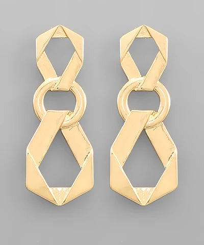 A pair of gold geometric drop earrings with interlocking circular and angular links, displayed on a neutral gray background.