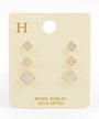 Set of gold-dipped earrings on a branded card with 'H' logo.