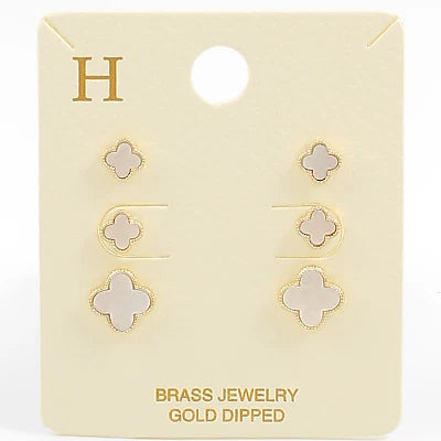 Set of gold-dipped earrings on a branded card with 'H' logo.