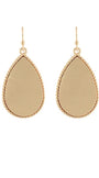 A pair of gold teardrop dangle earrings with a textured beaded border and a smooth, polished center, shown against a plain white background.
