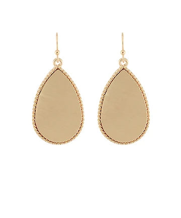 A pair of gold teardrop dangle earrings with a textured beaded border and a smooth, polished center, shown against a plain white background.