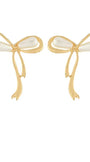 A pair of gold bow-shaped earrings with white pearl-like bead accents at the center, shown on a plain white background.
