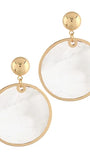 A pair of gold-tone drop earrings featuring large circular clear resin pendants with a subtle white marble pattern, suspended from polished gold ball studs.