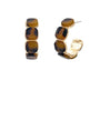 Pair of earrings with tortoiseshell design on a white background