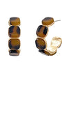 Pair of earrings with tortoiseshell design on a white background