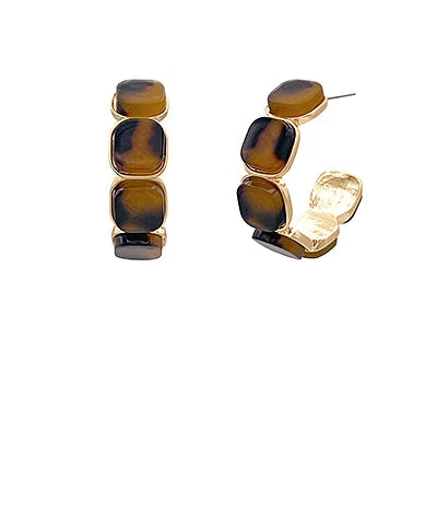 Pair of earrings with tortoiseshell design on a white background