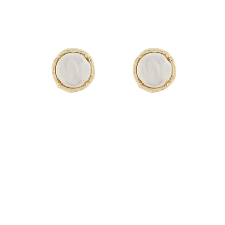 A pair of gold stud earrings with round, textured off-white mother-of-pearl centers, shown on a plain white background.