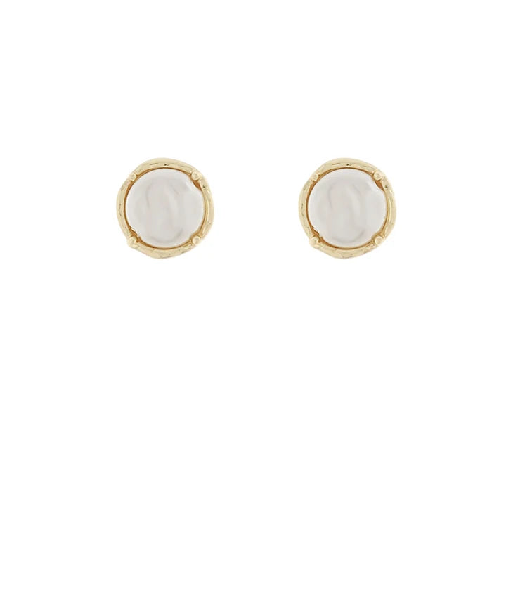 A pair of gold stud earrings with round, textured off-white mother-of-pearl centers, shown on a plain white background.