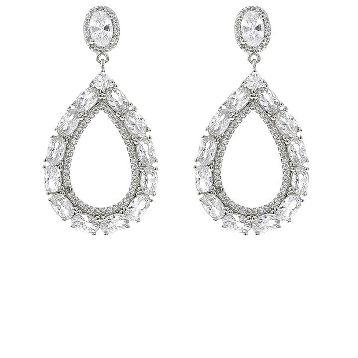 A pair of silver-tone teardrop dangle earrings adorned with clear marquise and oval-cut stones, set against a plain white background.