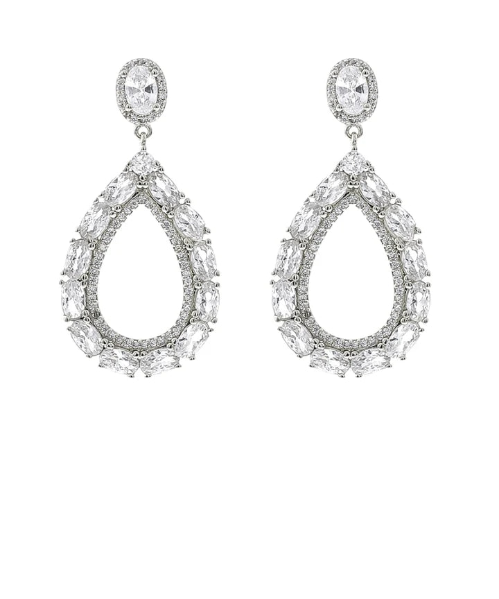 A pair of silver-tone teardrop dangle earrings adorned with clear marquise and oval-cut stones, set against a plain white background.