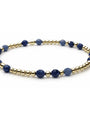 Bracelet with blue beads and gold accents on a white background