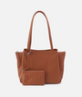 Brown leather handbag with matching pouch on a white background