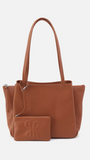 Brown leather handbag with matching pouch on a white background