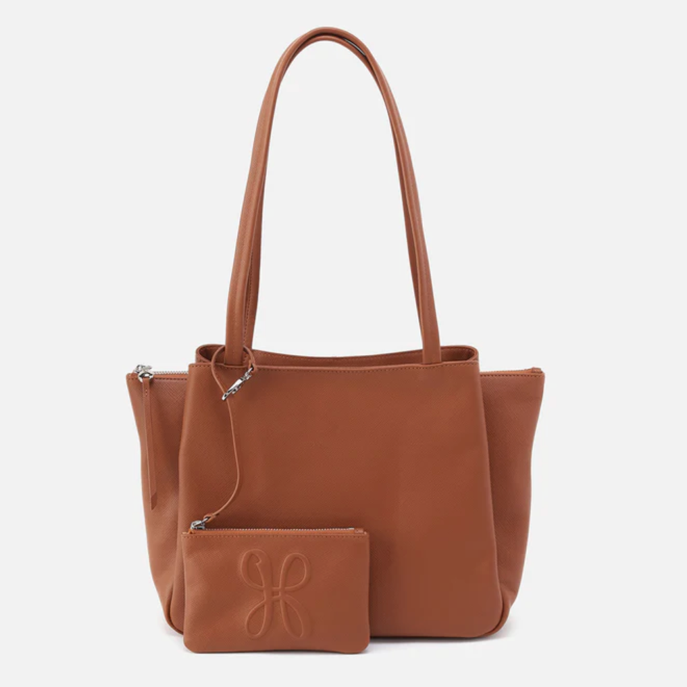 Brown leather handbag with matching pouch on a white background