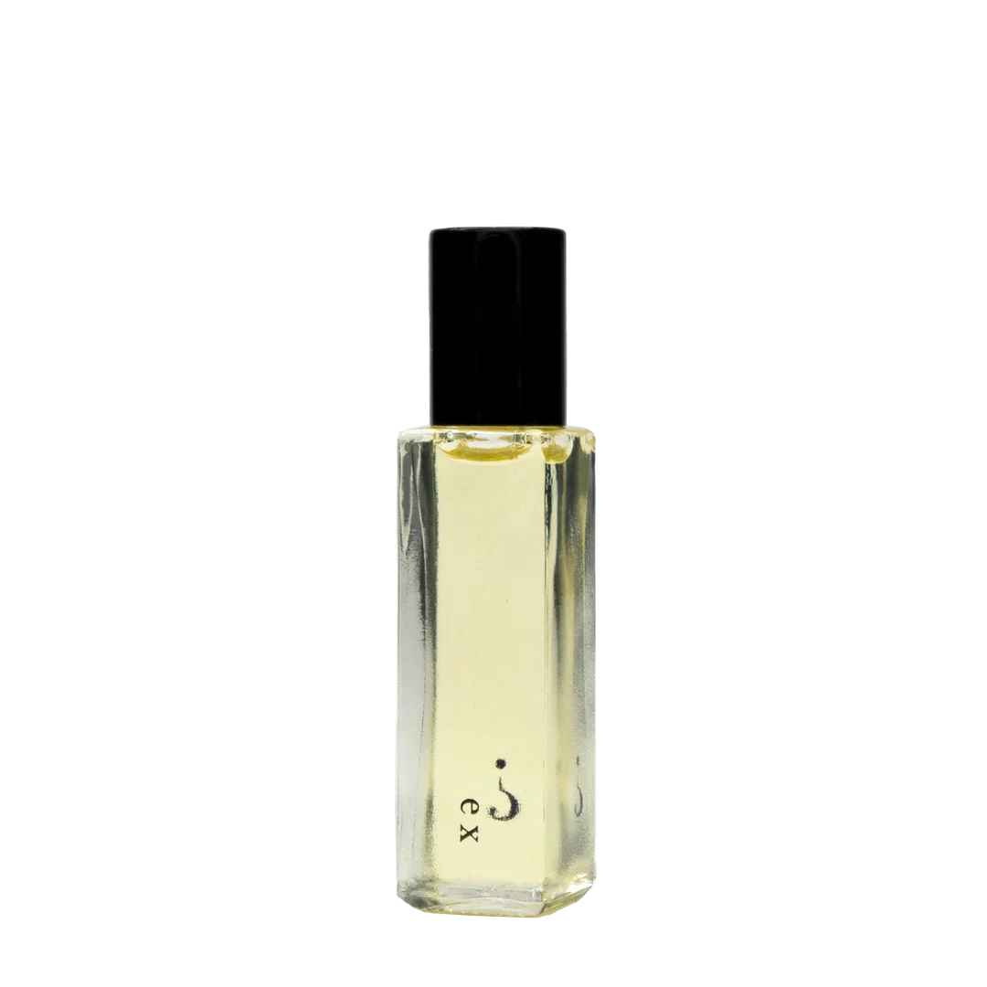 Clear glass bottle with black cap on a white background