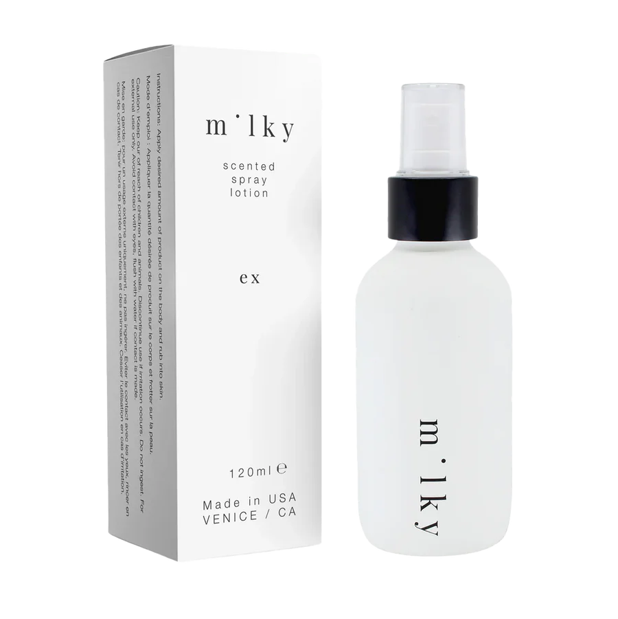 Milky scented spray lotion with packaging on a white background