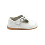 White child's shoe with a brown sole on a white background
