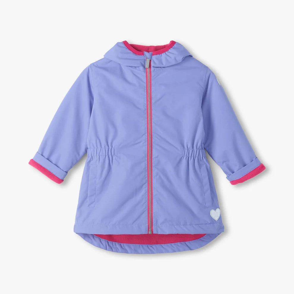 A light purple hooded jacket with bright pink trim on the zipper, hood lining, cuffs, and hem, featuring a small white heart on the lower right hem, shown against a light off-white background.