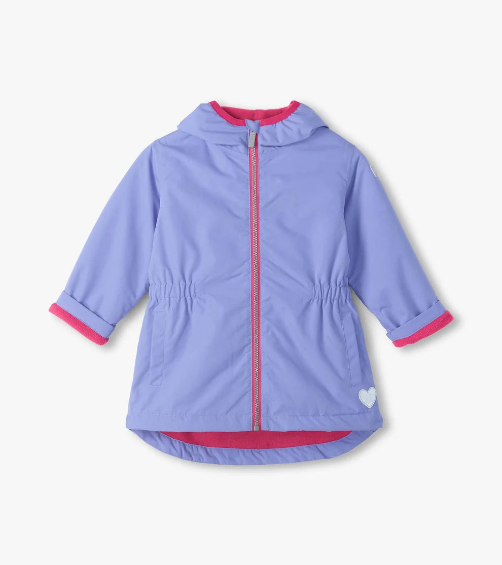 A light purple hooded jacket with bright pink trim on the zipper, hood lining, cuffs, and hem, featuring a small white heart on the lower right hem, shown against a light off-white background.