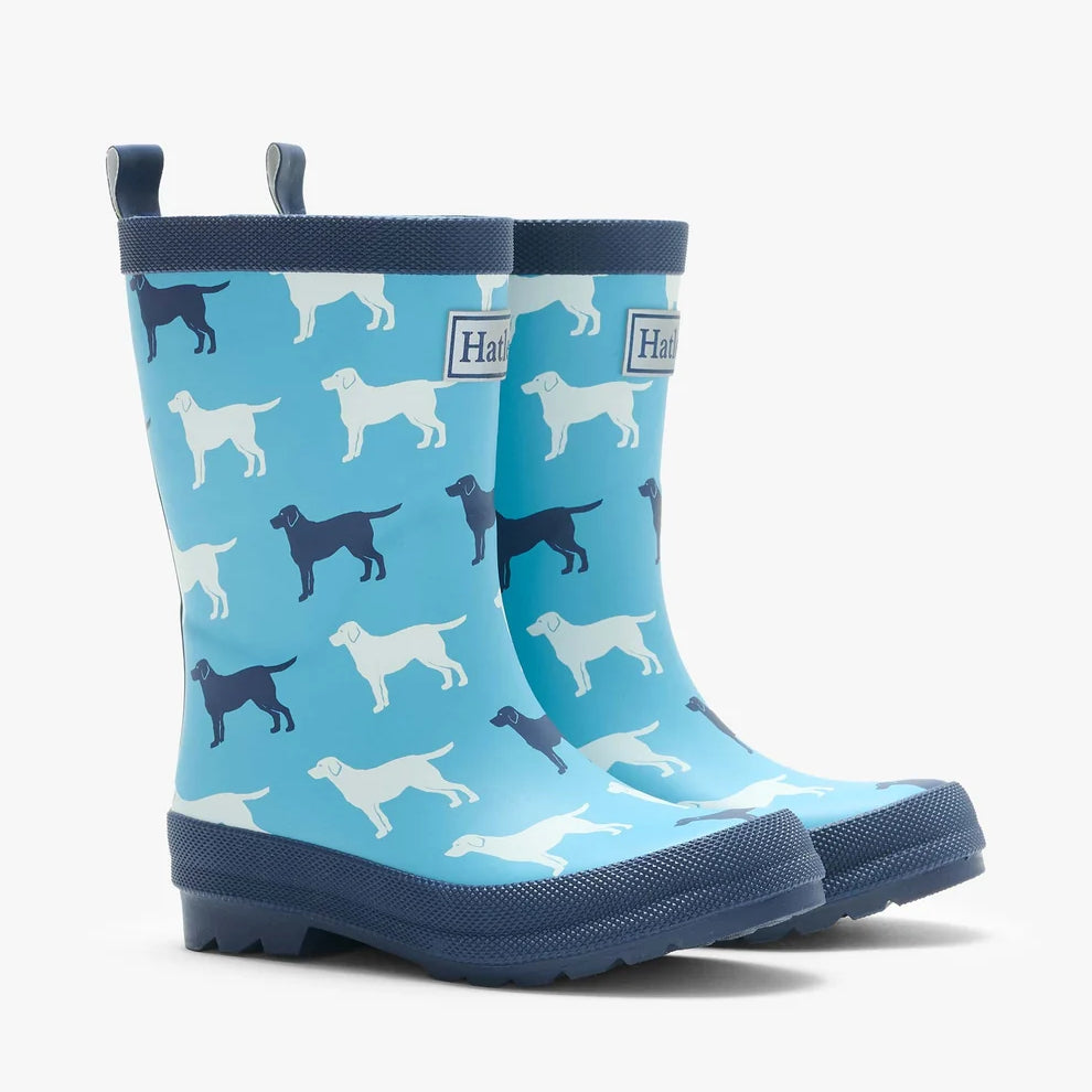 Blue children's wellington boots with dog pattern on a white background