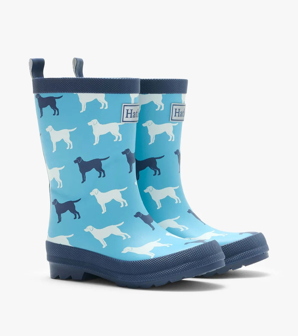 Blue children's wellington boots with dog pattern on a white background