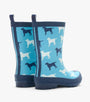 Navy rain boots with dog pattern on a blue background