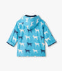 Blue children's raincoat with dog pattern on a white background