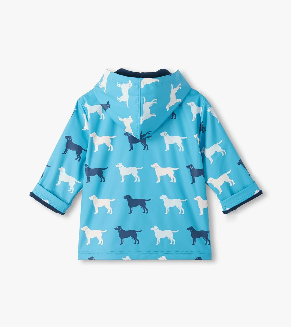 Blue children's raincoat with dog pattern on a white background