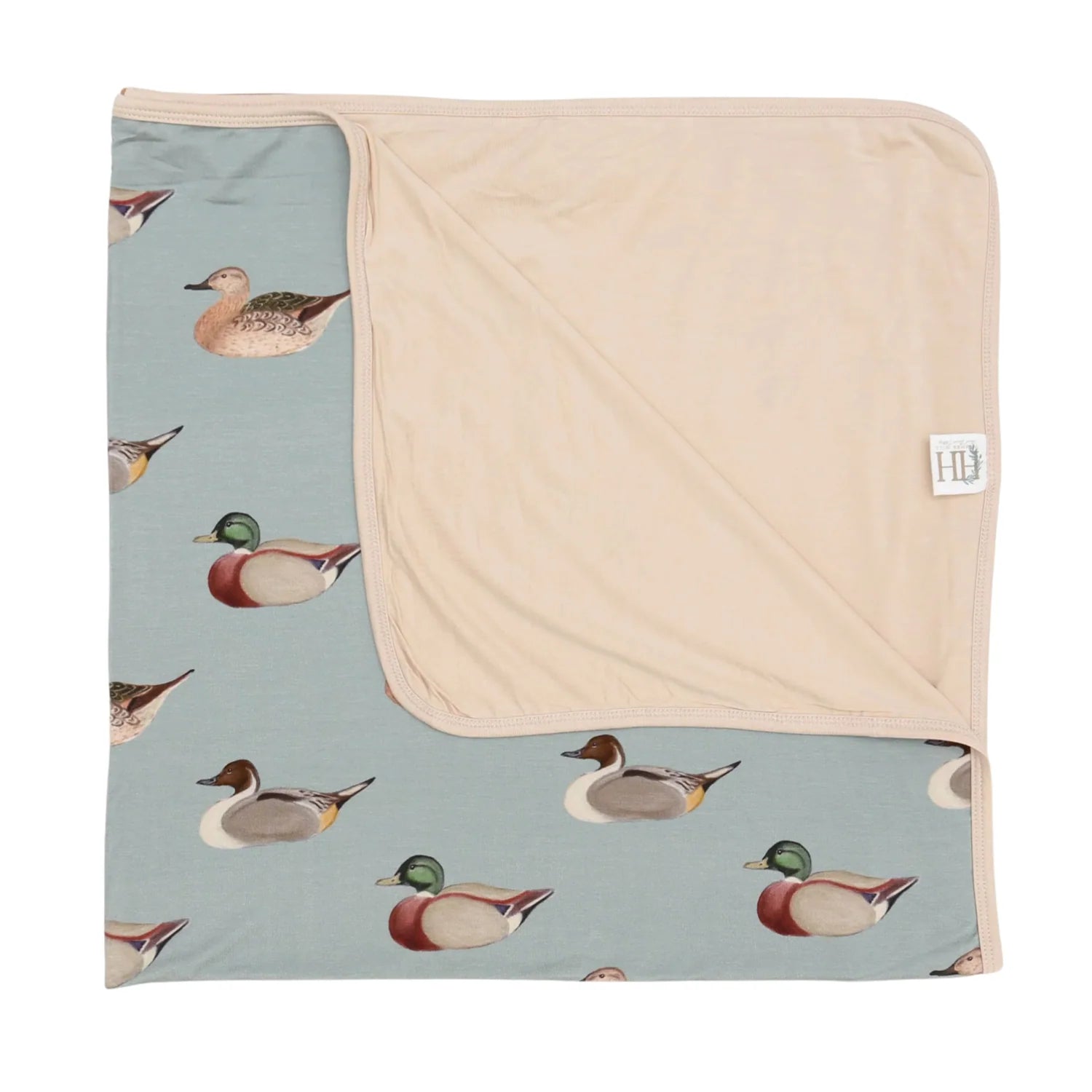 Baby blanket with duck pattern on a light blue background