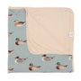 Baby blanket with duck pattern on a light blue background