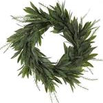 Artificial green wreath with leaves on a white background