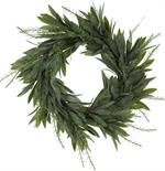 Artificial green wreath with leaves on a white background