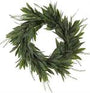 Artificial green wreath with leaves on a white background