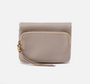 Beige leather wallet with a gold zipper on a white background