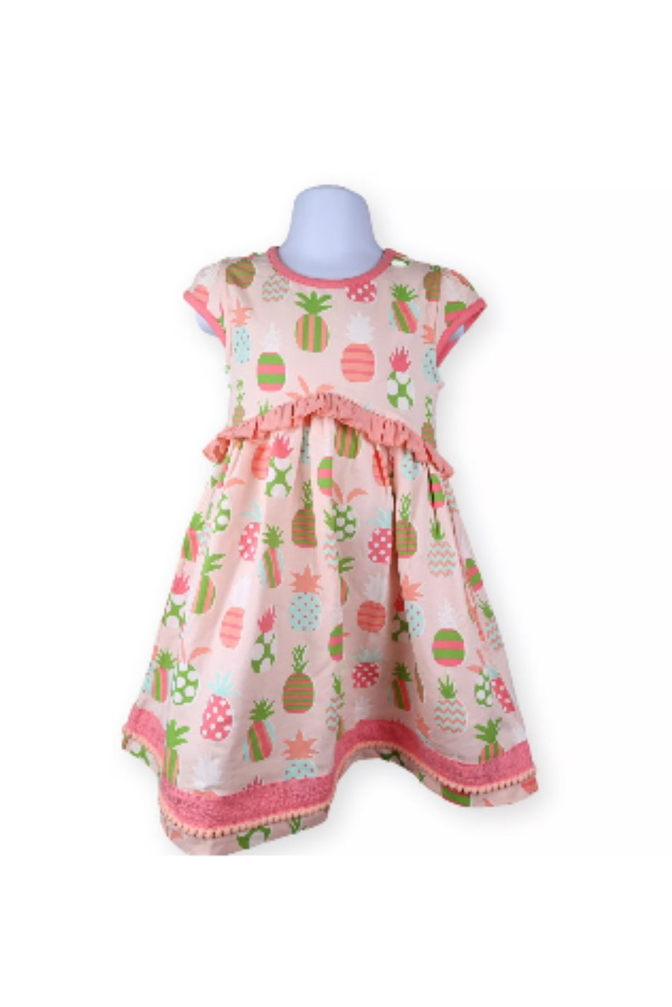 Children's dress with pineapple pattern on a white background