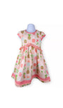 Children's dress with pineapple pattern on a white background