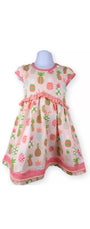 Children's dress with pineapple pattern on a white background