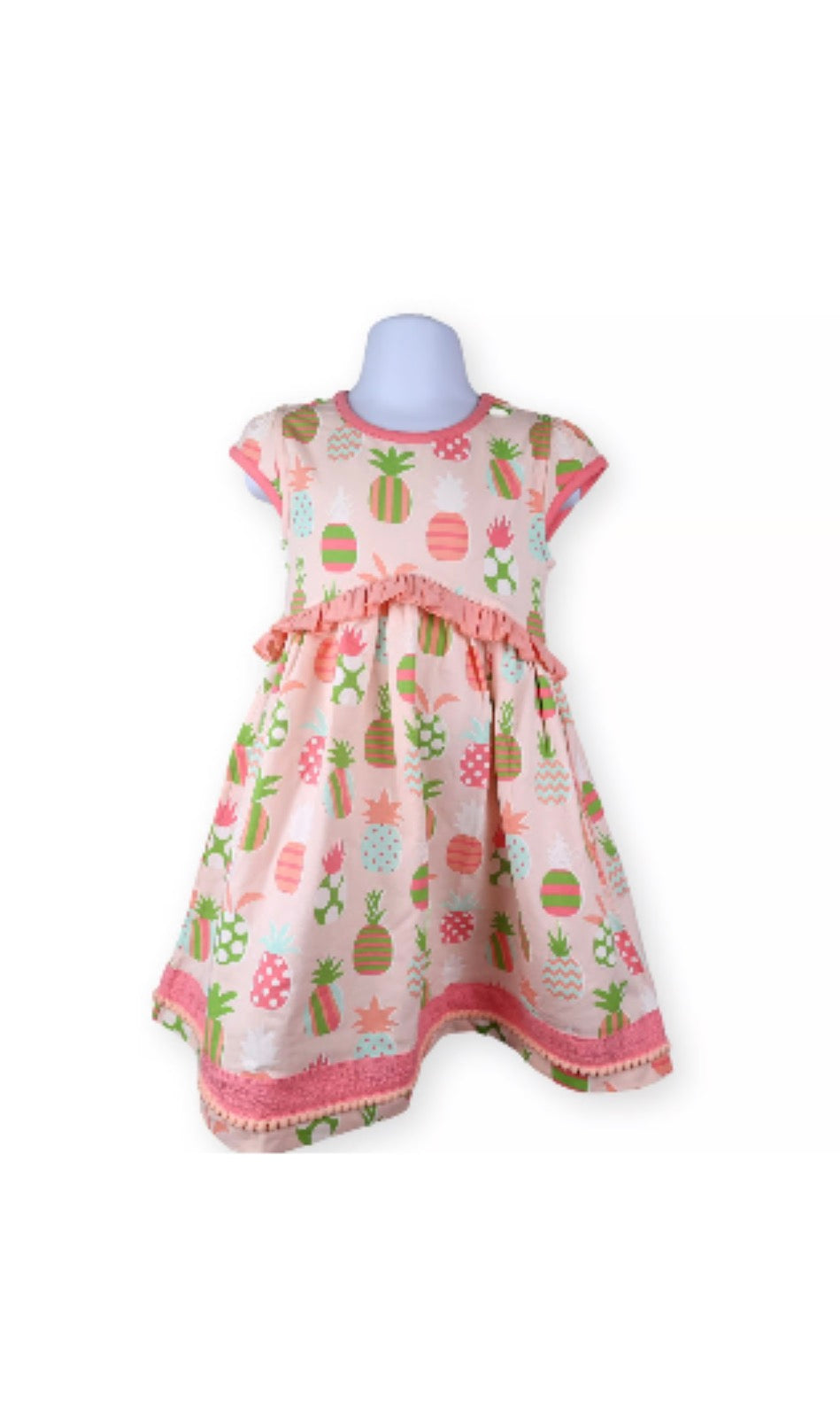 Children's dress with pineapple pattern on a white background