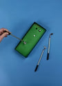 Golf simulator device with golf club and ball on a blue background