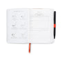 Golf-themed planner with golf club illustrations and a pen on a white background
