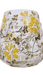 Stemless glass candle holder with floral design on a white background