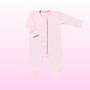 A light pink long-sleeve baby footed sleeper with an asymmetrical zipper, laid flat against a soft pink gradient background.