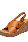 Brown wedge sandal with cork sole on a white background